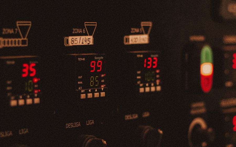 Digital readouts glowing on a facility control panel