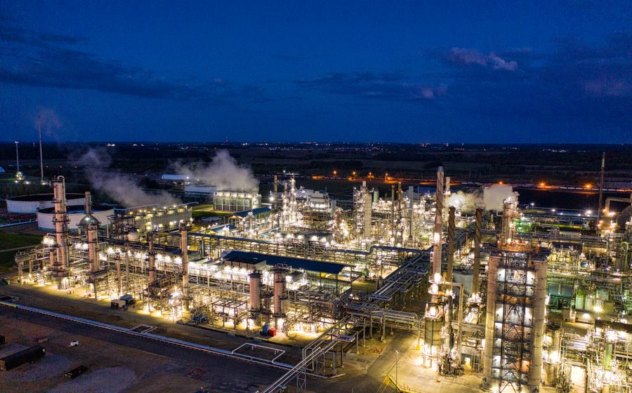 Industrial facility illuminated at dusk
